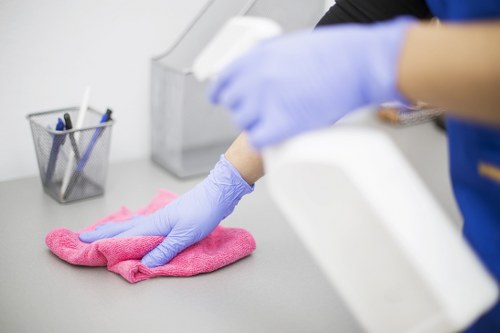 Professional deep cleaning team preparing a safe cleaning area in Bow