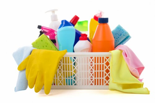 Commercial cleaning team sanitising shared office surfaces