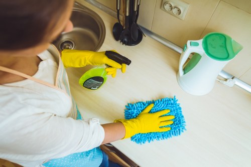 Reliable cleaners in Bow working in a bright office environment